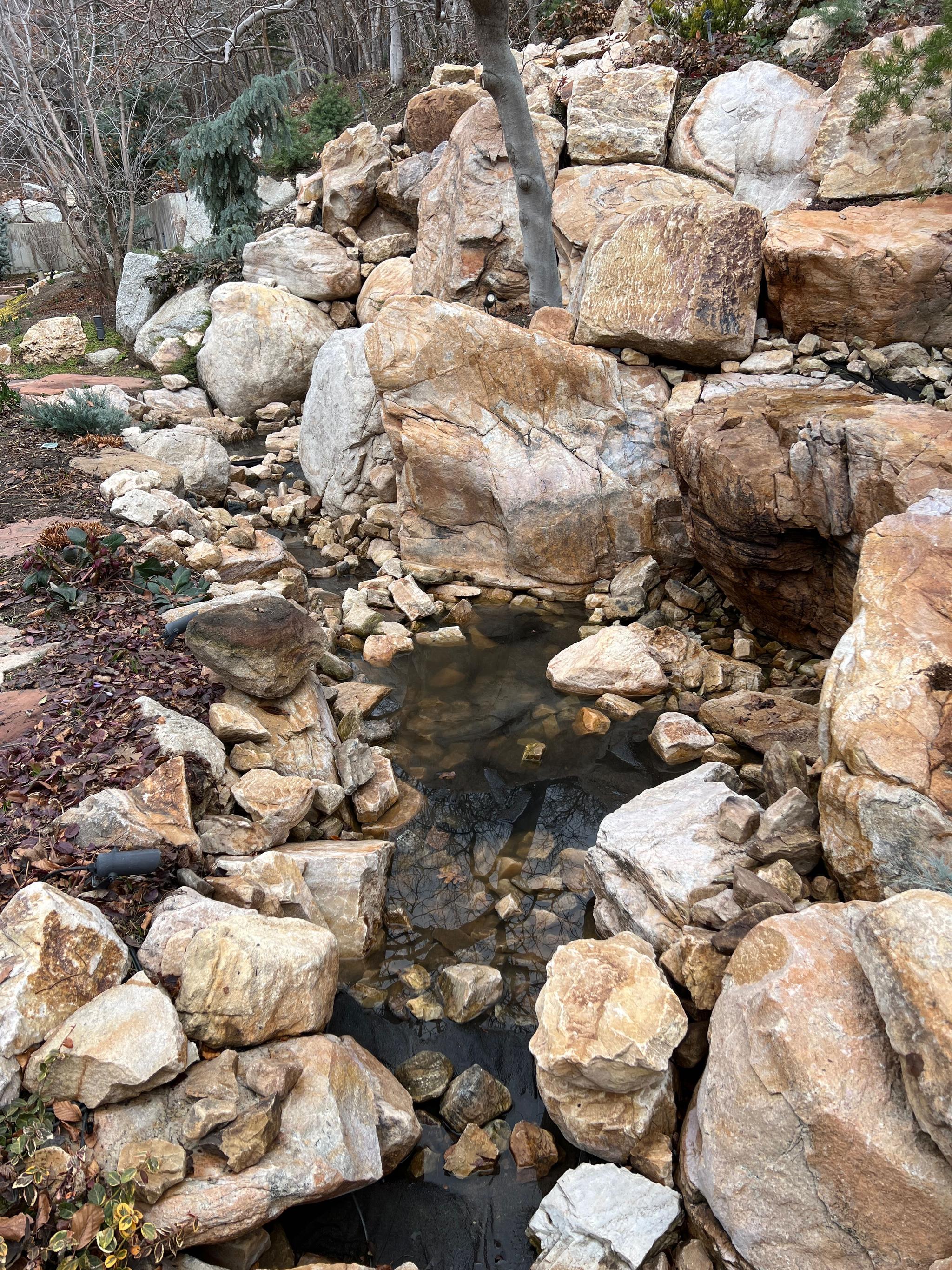 Boulder-lined water feature maintained on the Salt Lake bench