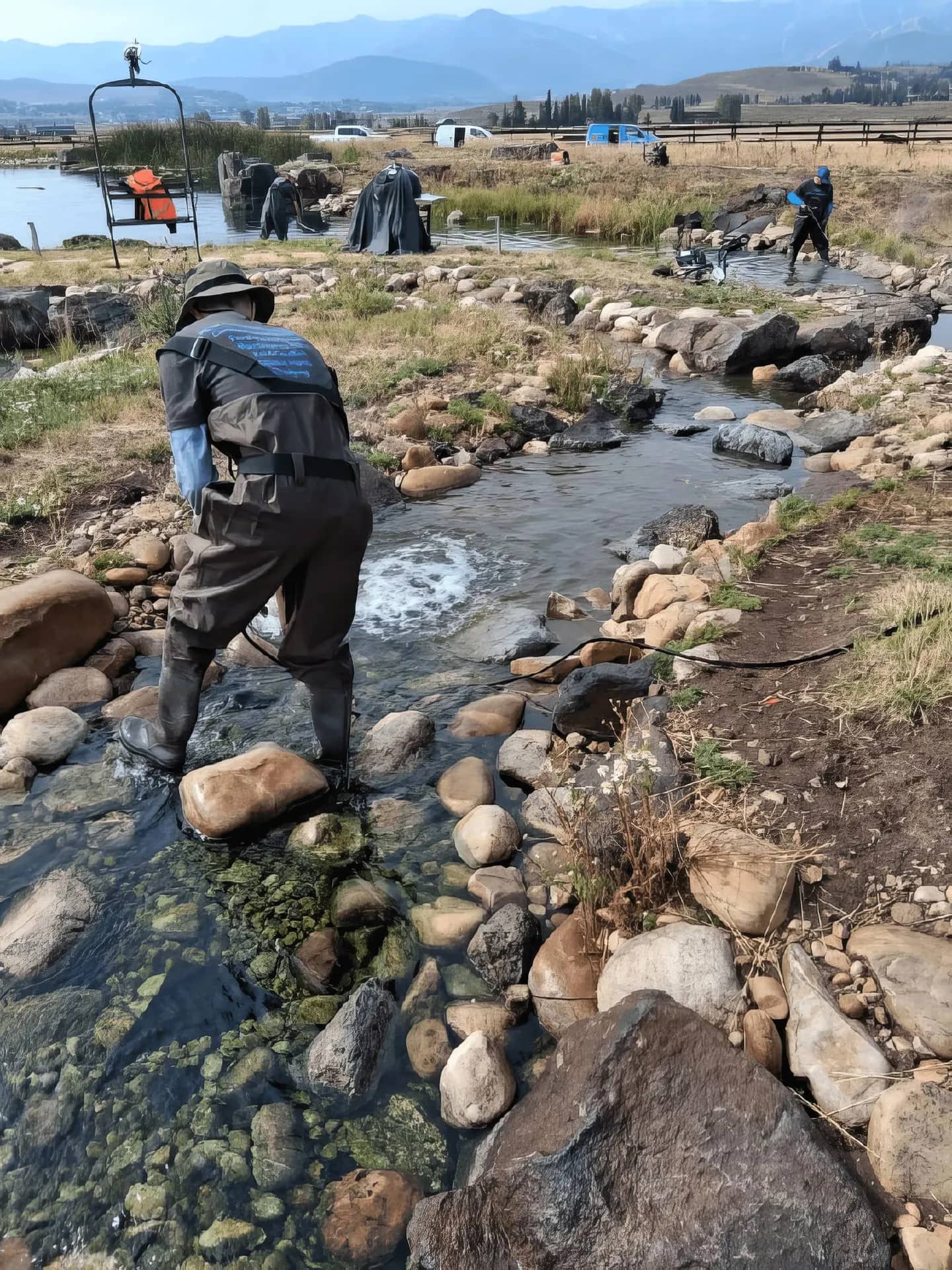 Backyard pond with stream and mountain views in Provo