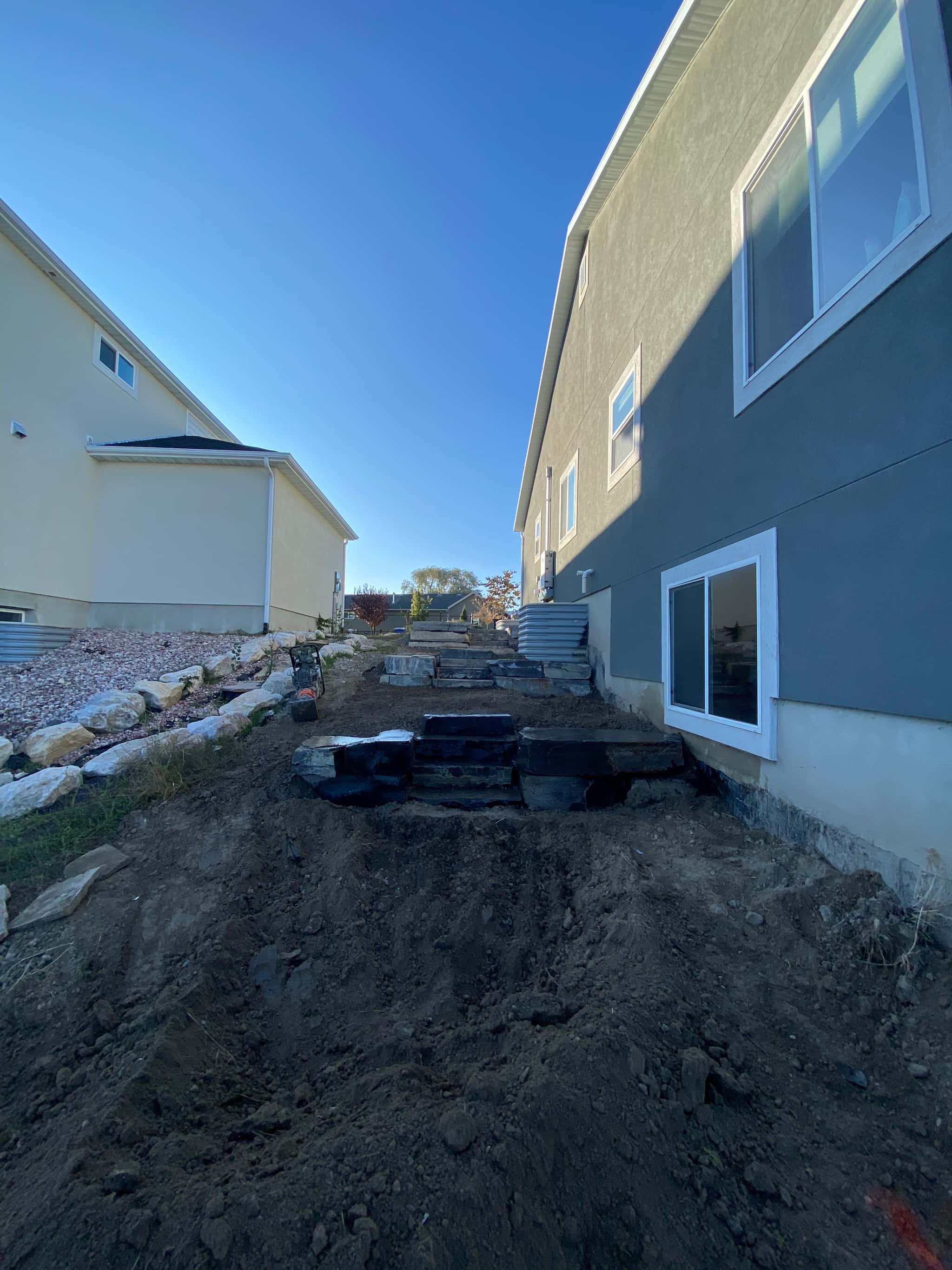 Residential pond design with natural edges and surrounding landscape