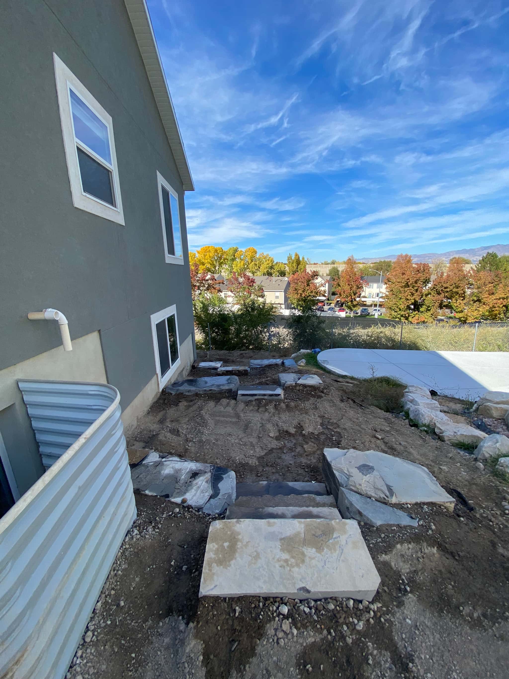 Excavation and shaping in progress during pond construction