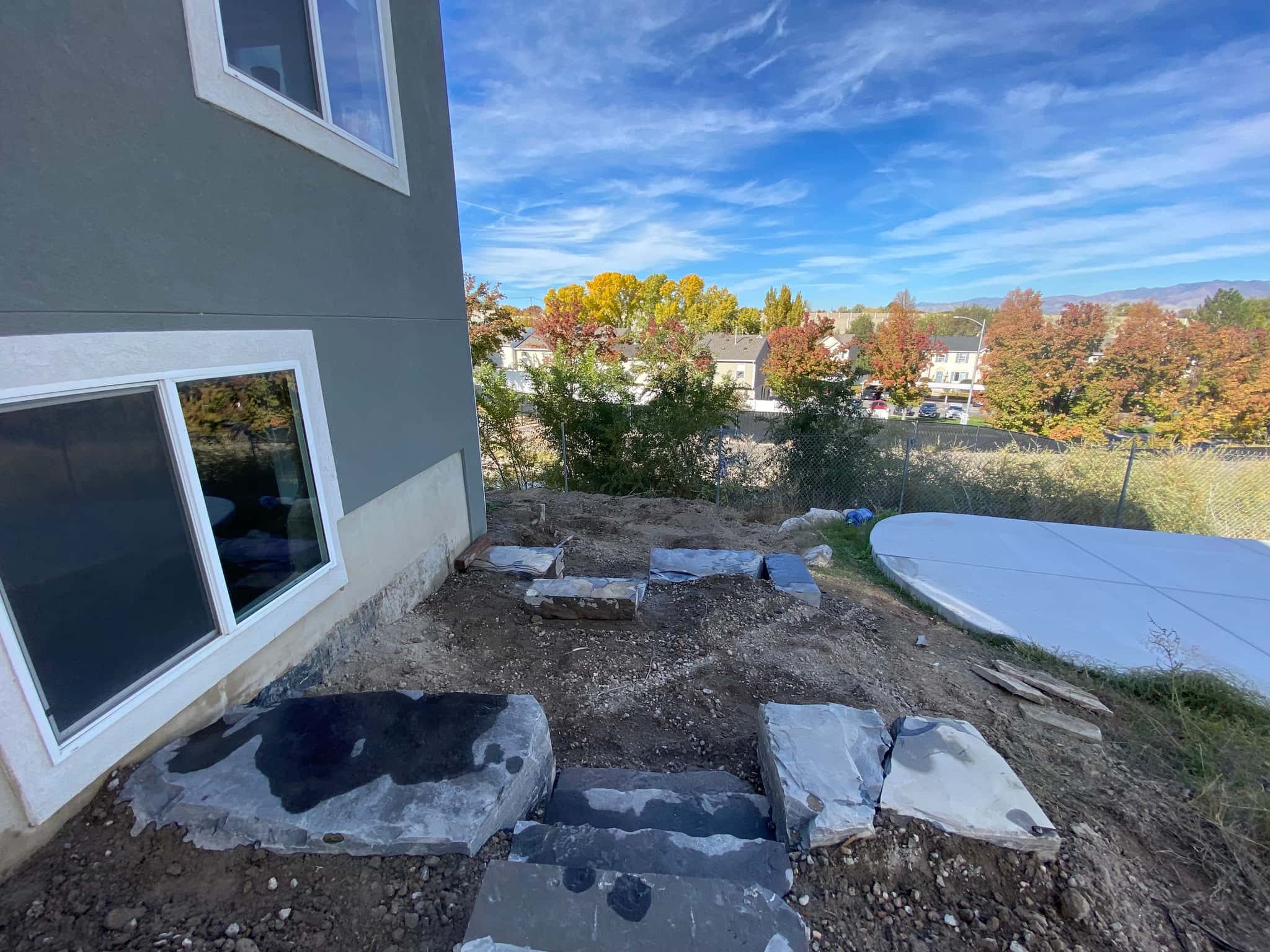 Liner and rockwork installation during pond construction