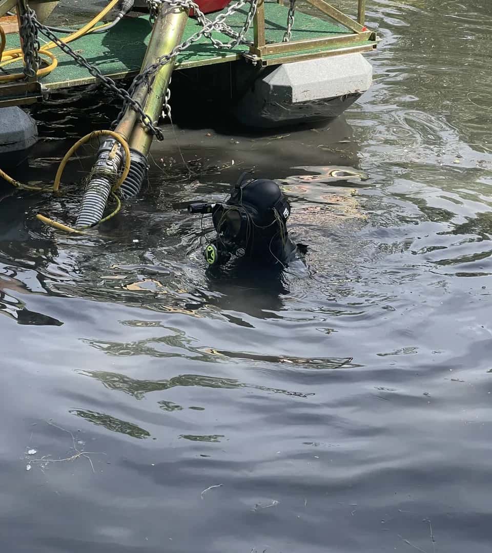 Utah Water Gardens professional diver in full diving gear ready for pond dredging service