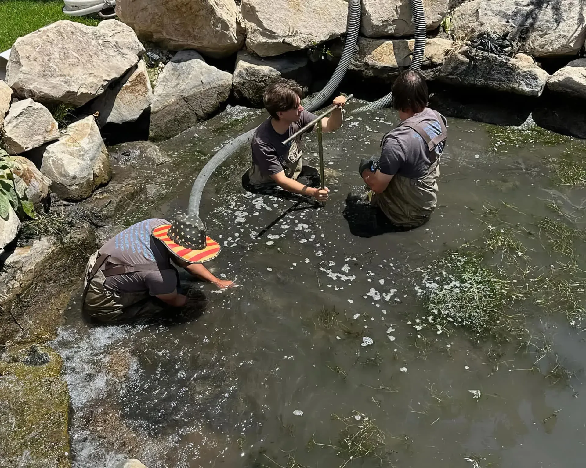 Technician performing pond maintenance in Salt Lake City Utah