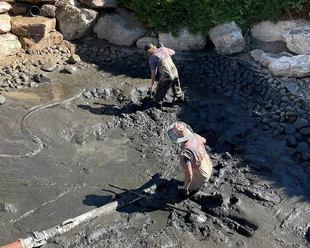Professional pond dredging service removing sediment