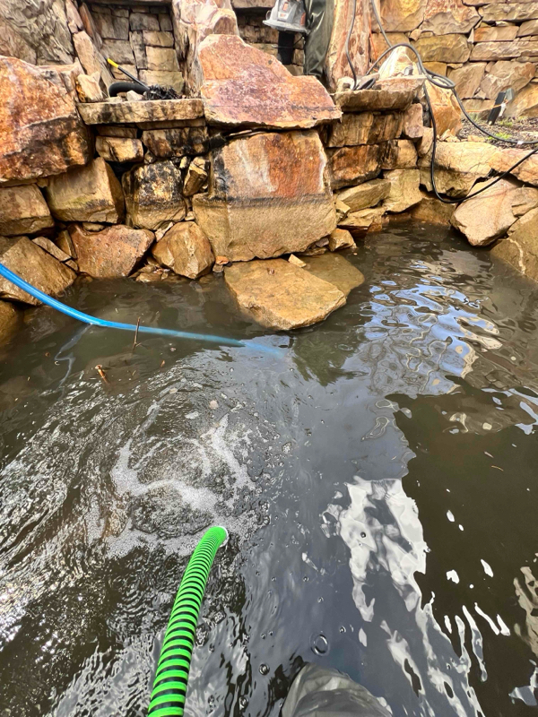 Annual cleaning at a stone water feature in Park City