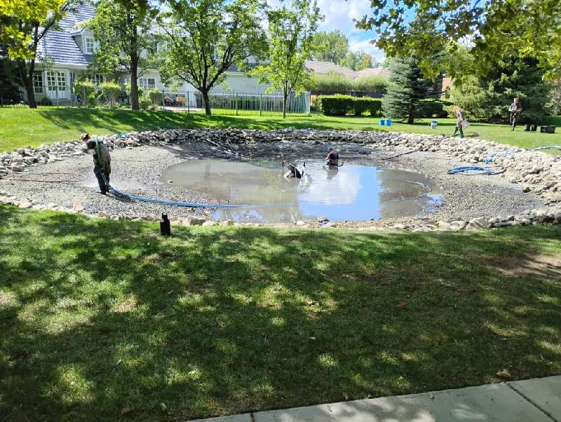 Crew working in one of two sediment-filled ponds in Provo